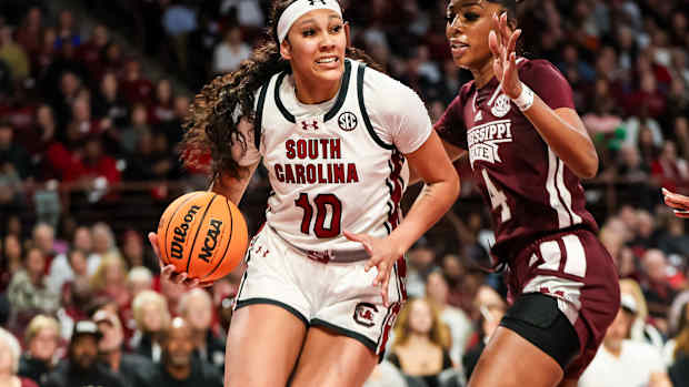 Kamilla Cardoso drives around Mississippi State Bulldogs